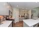 Well-lit kitchen featuring a gas range, stainless appliances, and quartz countertops at 925 Bent Branch Cir, Greenwood, IN 46143