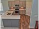 Kitchen boasts modern appliances, gray cabinets, and wood flooring at 925 Bent Branch Cir, Greenwood, IN 46143