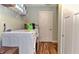 This laundry room has a washer and dryer along with storage shelves for convenient and organized laundry care at 925 Bent Branch Cir, Greenwood, IN 46143