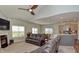 Inviting living room features a fireplace, ceiling fan and opens to the kitchen at 925 Bent Branch Cir, Greenwood, IN 46143