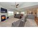 Inviting living room features a fireplace, ceiling fan and opens to the kitchen at 925 Bent Branch Cir, Greenwood, IN 46143