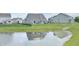 Charming backyard view featuring a pond and fountain, creating a serene and picturesque setting at 925 Bent Branch Cir, Greenwood, IN 46143