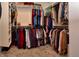 This is a full walk-in closet with hanging racks and shelving perfect for storing garments and accessories at 925 Bent Branch Cir, Greenwood, IN 46143