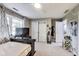 Bedroom featuring a window, closet, shelving, fan and a television at 9698 Coyote Ct, Noblesville, IN 46060