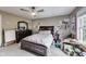 Cozy bedroom featuring a ceiling fan, dresser, and a window providing natural light at 9698 Coyote Ct, Noblesville, IN 46060