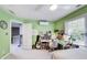 Bright bedroom with a desk area, guitar, and decor offers a creative and comfortable living space at 9698 Coyote Ct, Noblesville, IN 46060