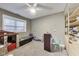 Neutral-toned bedroom with toys, a playhouse, carpet, and a window for natural light at 9698 Coyote Ct, Noblesville, IN 46060