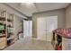 Neutral-toned bedroom featuring shelving, toys, a double closet, carpet, and ample storage at 9698 Coyote Ct, Noblesville, IN 46060
