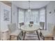 Charming breakfast nook featuring a round table with seating and bay windows providing natural light at 9698 Coyote Ct, Noblesville, IN 46060