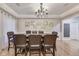 Elegant dining room with hardwood floors, decorative chandelier, and neutral wall colors at 9698 Coyote Ct, Noblesville, IN 46060
