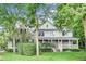 Charming two-story home with a welcoming front porch and mature trees in a beautifully landscaped yard at 9698 Coyote Ct, Noblesville, IN 46060