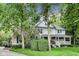 Beautiful two-story home featuring a combination of brick and siding, surrounded by lush trees and landscaping at 9698 Coyote Ct, Noblesville, IN 46060