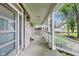 Spacious front porch with white railings, brick detailing, and a modern front door, perfect for outdoor enjoyment at 9698 Coyote Ct, Noblesville, IN 46060