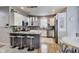 Modern kitchen featuring white cabinets, granite countertops, stainless steel appliances, and island with seating at 9698 Coyote Ct, Noblesville, IN 46060