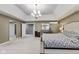 A spacious main bedroom shows a doorway into the main bath and walk-in closet at 9698 Coyote Ct, Noblesville, IN 46060