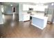 Modern kitchen with white cabinets, stainless steel appliances, and a central island, perfect for Gathering gatherings at 10112 Split Rock Way, Brownsburg, IN 46112