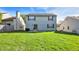 Expansive backyard with a well-maintained lawn and blue siding at 1024 Rotherham Ln, Beech Grove, IN 46107