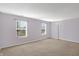 Bright bedroom featuring carpeted floors, light purple walls and plenty of natural light from two windows at 1024 Rotherham Ln, Beech Grove, IN 46107
