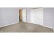 Comfortable bedroom featuring carpet, neutral walls, a closet, and doorway at 1024 Rotherham Ln, Beech Grove, IN 46107