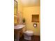 Charming powder room with pedestal sink and custom storage at 1065 Lakewood South Dr, Brownsburg, IN 46112