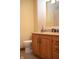 Cozy bathroom featuring a granite countertop and wooden cabinets at 1065 Lakewood South Dr, Brownsburg, IN 46112