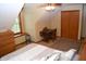 Cozy bedroom featuring a sloped ceiling, ceiling fan, neutral carpet, and natural light from the window at 1065 Lakewood South Dr, Brownsburg, IN 46112