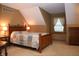 Spacious bedroom with carpet, a large window, wooden furniture, and warm-toned paint for a cozy feel at 1065 Lakewood South Dr, Brownsburg, IN 46112