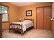 Well-lit bedroom featuring carpet, a bed, closet, window, and neutral-colored walls at 1065 Lakewood South Dr, Brownsburg, IN 46112
