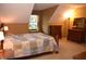 Cozy bedroom with vaulted ceilings, a large window, neutral carpet, and vintage-style wooden dressers at 1065 Lakewood South Dr, Brownsburg, IN 46112