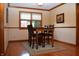 Charming dining room featuring hardwood floors and natural light from a nearby window at 1065 Lakewood South Dr, Brownsburg, IN 46112