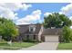 Charming two-story home with well-maintained lawn, mature trees, and attached two-car garage at 1065 Lakewood South Dr, Brownsburg, IN 46112