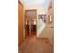 Inviting hallway with tiled floor and a view into the kitchen and dining areas at 1065 Lakewood South Dr, Brownsburg, IN 46112