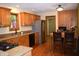Well-lit kitchen featuring wood cabinets, stainless steel appliances and an adjacent dining area at 1065 Lakewood South Dr, Brownsburg, IN 46112