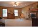 Inviting living room features a brick fireplace, large windows, and neutral decor at 1065 Lakewood South Dr, Brownsburg, IN 46112