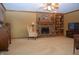 Cozy living room with brick fireplace, built-in shelving, and comfortable seating at 1065 Lakewood South Dr, Brownsburg, IN 46112