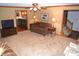Inviting living room with open floorplan, plush furniture, and seamless transition to the kitchen at 1065 Lakewood South Dr, Brownsburg, IN 46112