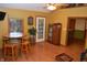 Cozy living area featuring a custom barrel table with seating and hardwood floors at 1065 Lakewood South Dr, Brownsburg, IN 46112