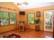 An open living area featuring a custom bar table, stools, and an outside view at 1065 Lakewood South Dr, Brownsburg, IN 46112