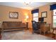 Comfortable home office with a futon couch and lots of natural light at 1065 Lakewood South Dr, Brownsburg, IN 46112
