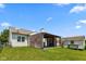 Backyard showcasing a covered patio and shed, perfect for outdoor activities and storage at 10725 Tedder Lake Dr, Indianapolis, IN 46239