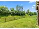 Expansive backyard featuring a lush lawn and a secure fence, ideal for pets and recreation at 10725 Tedder Lake Dr, Indianapolis, IN 46239