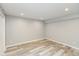 Finished basement with recessed lights and light-colored wood-look floors at 10725 Tedder Lake Dr, Indianapolis, IN 46239