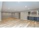 Basement view with a stylish wet bar and ample lighting, great for entertaining guests at 10725 Tedder Lake Dr, Indianapolis, IN 46239