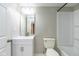 White bathroom with a new sink, cabinet, toilet, and shower-tub combination at 10725 Tedder Lake Dr, Indianapolis, IN 46239