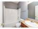 Bathroom features a vanity with a sink, toilet, and shower-tub combination at 10725 Tedder Lake Dr, Indianapolis, IN 46239