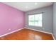 Comfortable bedroom features large window offering natural light at 10725 Tedder Lake Dr, Indianapolis, IN 46239