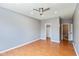 Neutral bedroom boasts wood floors, a closet, and an attached bathroom at 10725 Tedder Lake Dr, Indianapolis, IN 46239