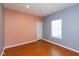 Bright bedroom features hardwood floors, neutral paint and a window at 10725 Tedder Lake Dr, Indianapolis, IN 46239