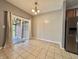 Cozy dining area with tile flooring and sliding glass doors at 10725 Tedder Lake Dr, Indianapolis, IN 46239