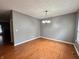 Bright dining room with wood floors and contemporary lighting at 10725 Tedder Lake Dr, Indianapolis, IN 46239
